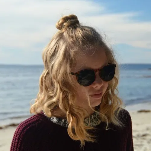 Messy Top Knot With Curls