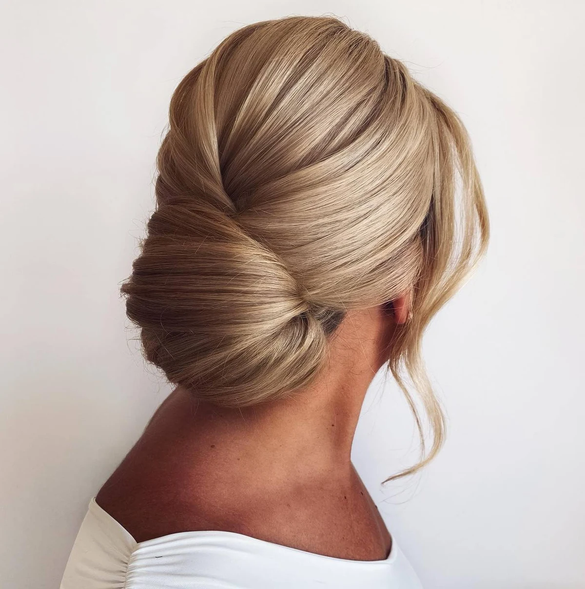 Voluminous Sleek Chignon With Side Sweep