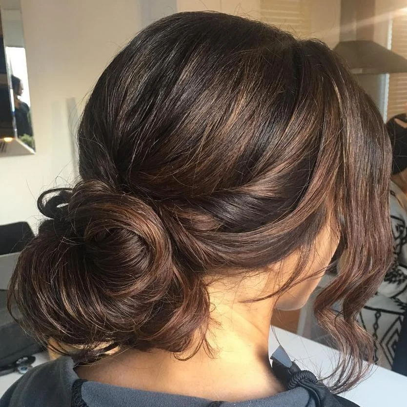 Wavy Brown Side Chignon Updo