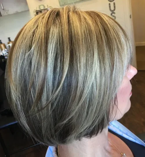 Layered bronde bob with blended bangs and glossy smooth finish