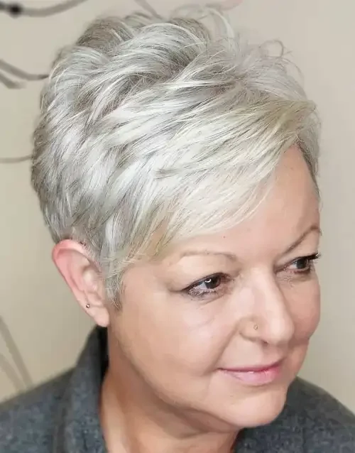 Side-swept pixie fringe with cool gray tone and textured top