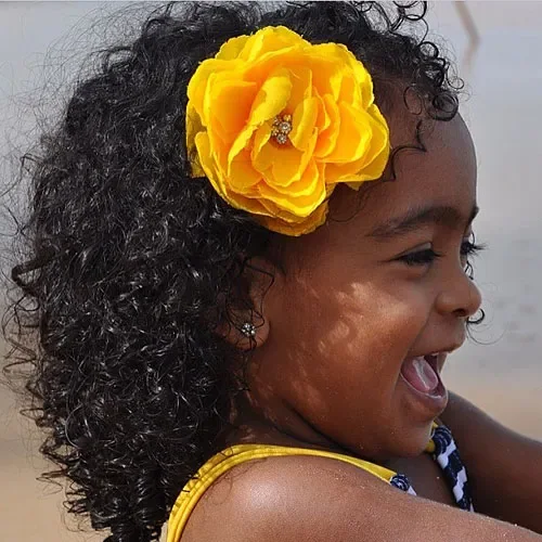 Curly Hair With Big Yellow Flower