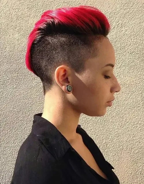 High-top mohawk with bright red center and shaved sides in a high fade