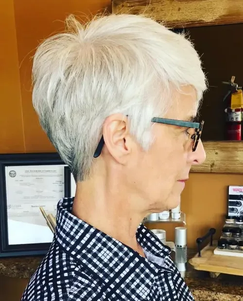 Cool light blonde tapered pixie crop with short forward layers