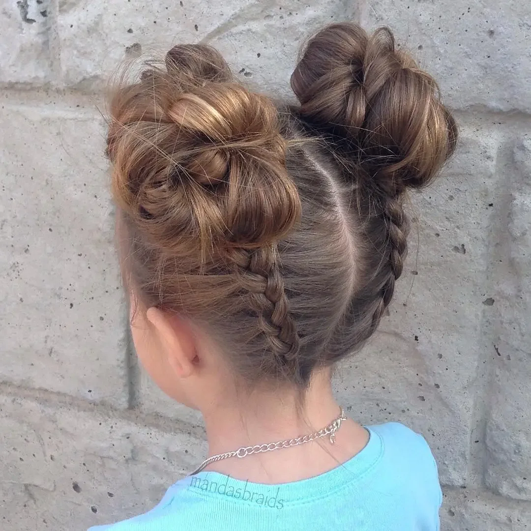 High knot-style buns made with Dutch braids and soft volume