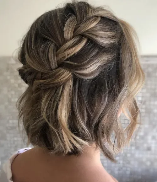 Braid-Accent Tousled Low Chignon