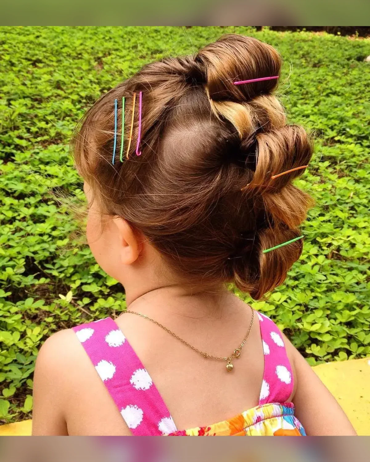 Faux hawk braid roll with bright color accents woven through the braids